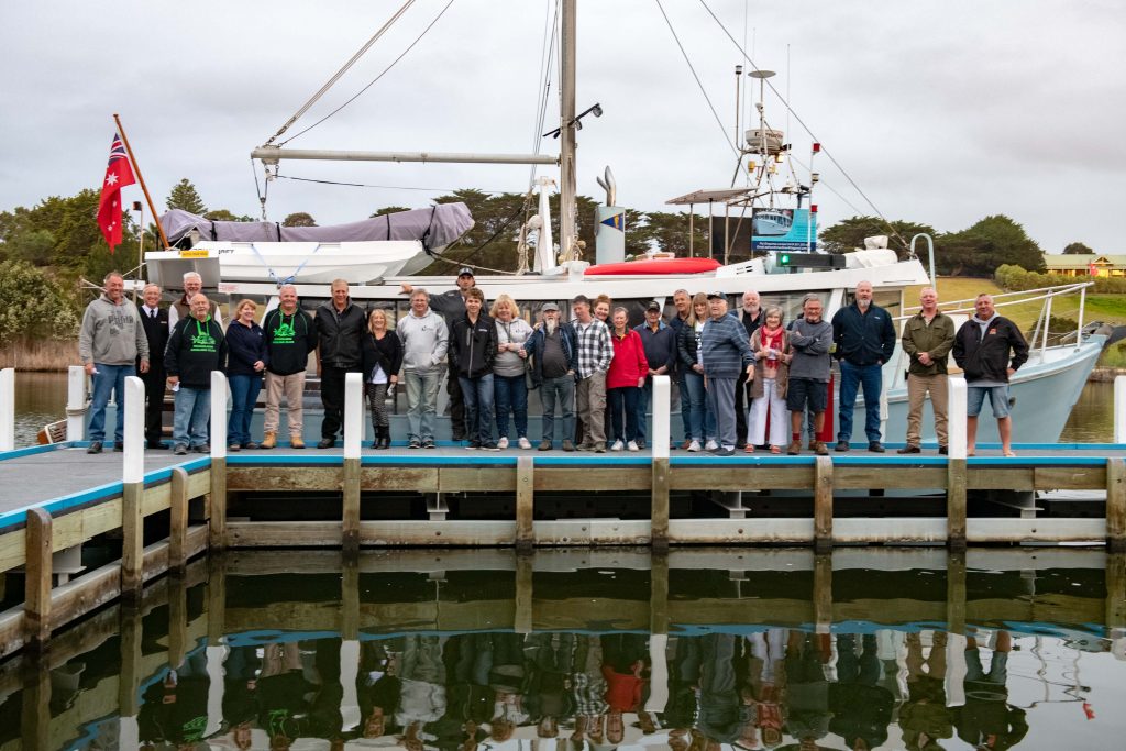 Community members and EGCMA staff stand in front of the Lady Jane boat moored on the Nicholson River in East Gippsland.