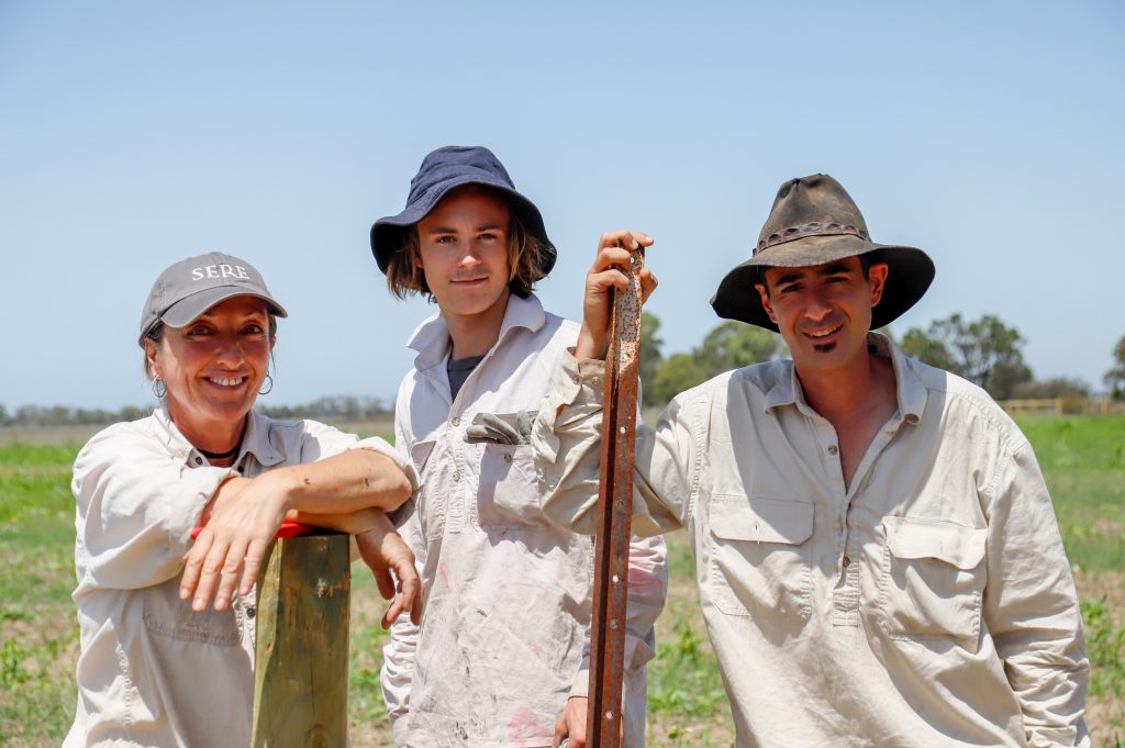 Members of the drought employment crew stand in a paddock